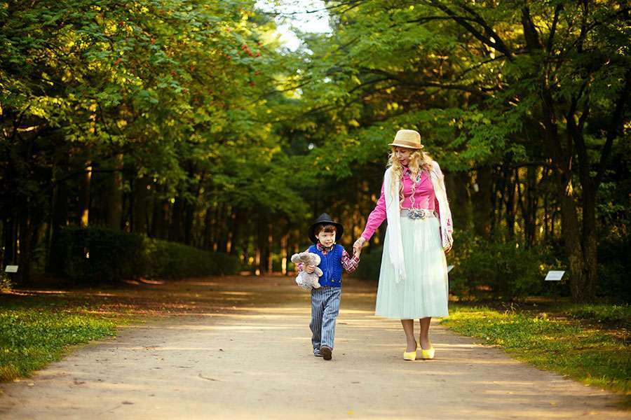 Mom-holding-her-son's-hand-and-Walking-in-the-road